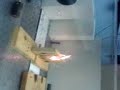 IR Laser burns through block of wood
