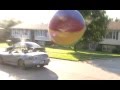 Cars ramming a giant ball