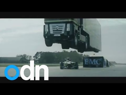 World record stunt: Giant truck jumps over speeding Lotus racing car