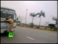 A Vietnamese traffic police officer went on a wild ride in Hanoi, clinging to the windshield wipers of a moving bus for nearly a kilometre after a rogue driver tried to avoid a ticket. Traffic lieutenant Nguyen Manh Phan pulled over Phung Hong Phuong, 37, in Hanoi on Monday for driving on the wrong side of the road, VN Express reported. Phuong refused to produce his papers and rushed back to the bus, prompting the officer to jump onto the front in an attempt to stop him. Video shot by one of Phan's fellow police officers shows the officer trying to get his footing and dangling precariously from the moving bus as oncoming traffic whizzes past. At one point the bus was travelling at 50 kmph (31mph). Phan could be heard shouting: 