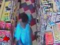 Woman waddles out of store with beer between her legs