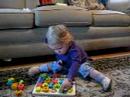 Laura plays with her puzzle