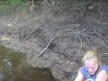 Heather showing how she has to pee while out fishing on the boat.