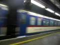 DF11 0025 hauls T817 through train through Mong Kok East Station
