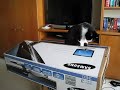 Kitty stands on a tv box