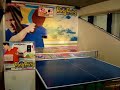 dave playing a ping pong arcade game.