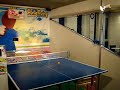 dave playing a ping pong arcade game.