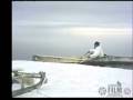 Alaskan seal hunter uses umiak (sea kayak) to retrieve prey