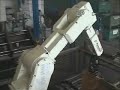 Kawasaki robot loading a pipe-end deforming machine Kawasaki robot loading a pipe-end deforming machine