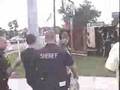 Police arest anti-bush person for saying f-bush on sign