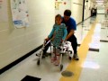 Erin speed walking in KAFOs