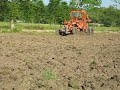 road grader pushing dirt