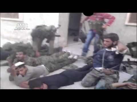 war criminal - FSA and Al-Nusra terrorists tried to get rid of unplasant witnesses of their use of chemical weapons against the Syrian civilians in March 2013...by executin...