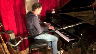 John Denies plays piano at sound vision Studio