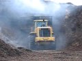 Deere 744H working a wood chip bucket