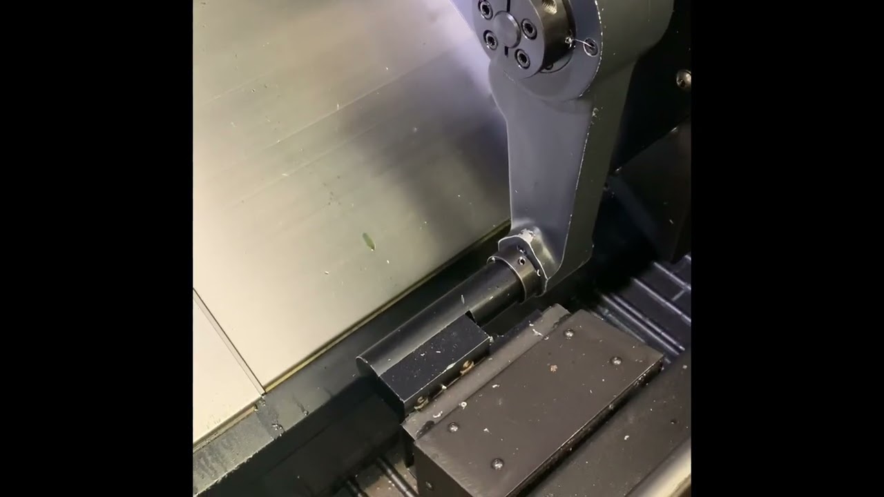 Doosan Puma 2100SY Turning Center 2013 with: Fanuc Control, Sub Spindle, Tool Pre-Setter, 3-Jaw Chuck, LNS Barfeed, Chip Conveyor, and Coolant Tank.