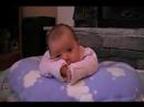 Ivy on her boppie w/ rattle