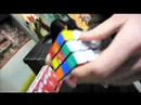 Brandon Joyce is challenged to solve one side of a rubix cube, along with a tricky disc game, in order to win a Kyle Korver action figure.He succeeds.
