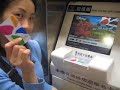 Hei recharging her subway card in Taipei, Taiwan