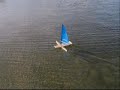 Showing speed and countering effect of leefoil. Starts out slow then gains speed with me running by and getting a front view as it sails past and gets a moderate puff showing the upper limit of countering effect of leefoil. Model is sailing to windward no daggerboards or fixed rudder