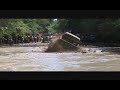 Brent Coleman in his dodge cummins mud truck on 54 boggers going across the pipeline at sabine river rats good friday ride 2012