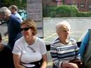 People Making Faces at a Bus Stop in England