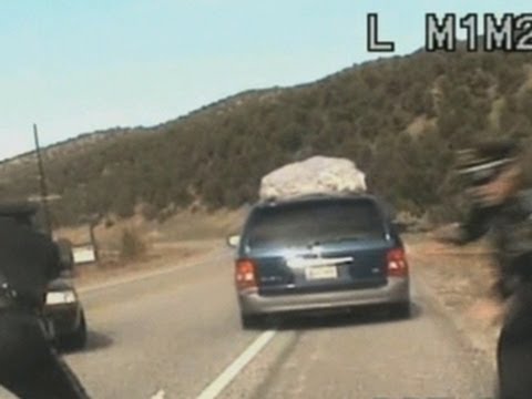 NM - Two New Mexico police officers are under investigation after one opened fire on a minivan with a mother and her five children inside. Bill Whitaker reports.