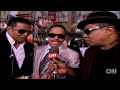 Larry King talks to Marlon, Jackie, and Tito Jackson at the premiere of Michael Jackson's documentary 'This is It.'