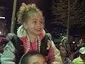 BEAUTIFUL LITTLE GIRL RECEIVES GOLD BEADS AT MARDI GRAS