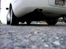 Striaght pipe, no muffler, stock tip.