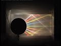 Light propagating in water reaches a plane surface separating water from air. A fraction of light reflects back and the remaining fraction refracts to air. As the incident angle goes up more and more light reflects until the critical angle is reached. For angles of incident greater than the critical angle all the light reaching the surface reflects (total internal reflection). Some colored filters are glued at the orifices. The original light from this apparatus is white halogen.