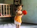 Lia playing tambourine