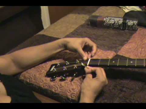 how to attach the strap to a guitar