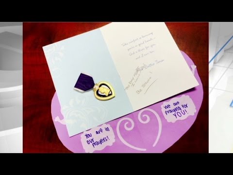 Anonymous military veteran gifts purple heart.