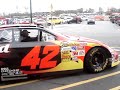 Montoya Nascar car turning on by team menber.