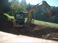 Loading tractor New Holland with excavator