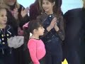 Melody with Oksana Baiul and other skaters at the Menorah lighting at Chanukah on Ice