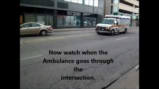 Ambulance almost hit by car