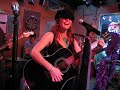 Amy Lou sings AND plays the guitar