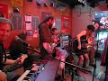 Amy Lou sings AND plays the guitar