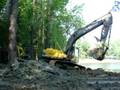 Excavator digging out a pond