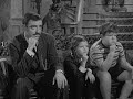 Morticia teaches Lurch how to dance