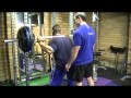 Lee Priest doing Barbell Squats in Powertec Power Rack