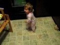 baby trying out new feetie pajamas