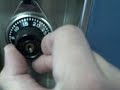 Mr. Piper gives a demonstration on how to open a Middle School locker.