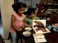 Namitha feeding and reading to Nitya