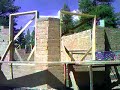 This was taken during the stacking phase of construction. we made the blocks on site with the foundation soil and the help of Earth Block Inc's compressed earth block machine.
