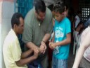 Tony & JP teaching his thumb trick to brazilan boy