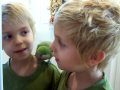 Little Boy Teaching Quaker Parrot How to Whistle