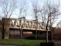 Two trains travel over bridge by Campbell Road in Bromley